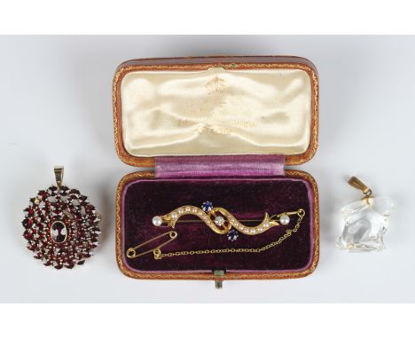 A gold, sapphire, diamond and seed pearl bar brooch in a scrolling design, unmarked, weight 4.1g, width 4.4cm, with a case, a
