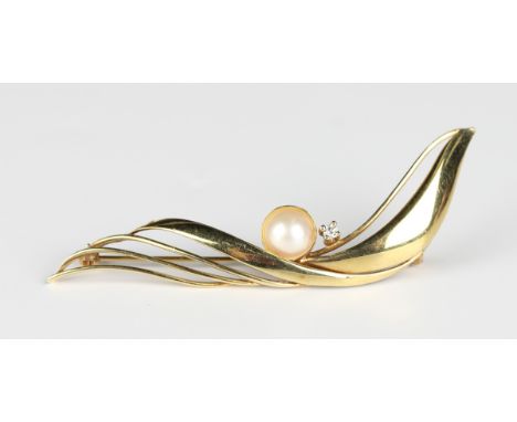 A gold, colourless gem and cultured pearl brooch in an abstract wavy design, detailed '585', weight 4.2g, width 6cm. Provenan