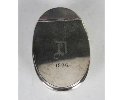 An Edwardian silver curved oval snuff box, the hinged lid engraved with the initial 'D' and dated '1906', Birmingham 1904 by 