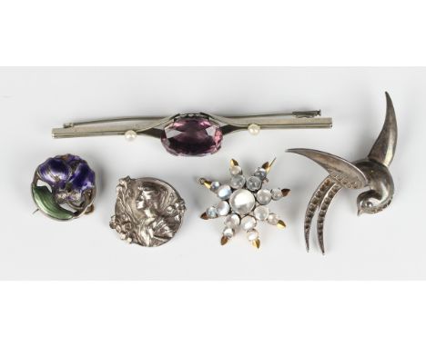 A French Emile Dropsy Art Nouveau silver circular brooch, designed as a portrait of a lady with irises, detailed 'E. Dropsy',
