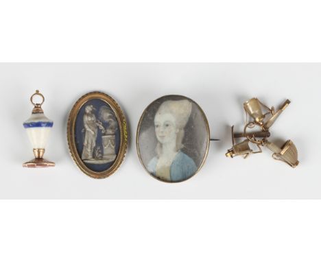 A gilt metal oval brooch, circa 1800, glazed with a portrait miniature of a lady, width 2.9cm (converted from a clasp), an ov