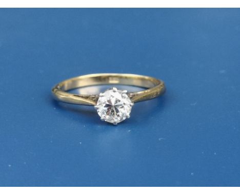 A diamond solitaire ring, the claw set brilliant weighing 0.55 carat, on yellow 18ct shank.  Finger size J/K.