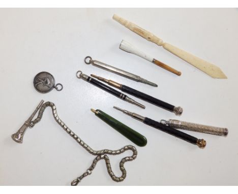 A small bone letter opener with Stanhope  showing six Malvern views,  a pair of Stanhope pencils - 'Souvenirs of Aberwystwith