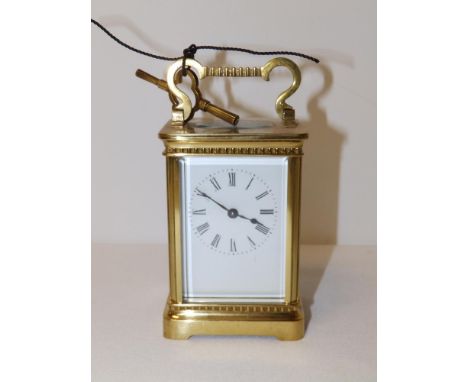 A French brass carriage clock by Richard &amp; Co., 4.5" high excluding handle.