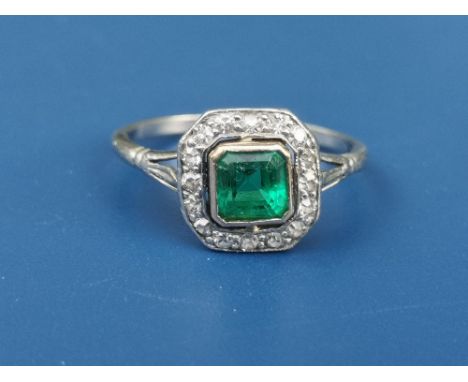 An Art Deco period emerald &amp; diamond square cluster ring in platinum.  Finger size K.