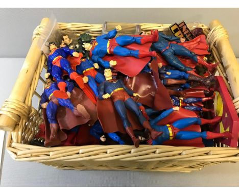 Basket full of loose superman 1/12 scale action figures 