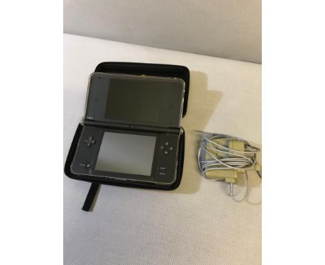 Nintendo DSi XL hand held console with charger and 7 games 