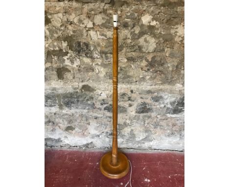Solid light oak standard lamp. Measures 165cm in height. working order 