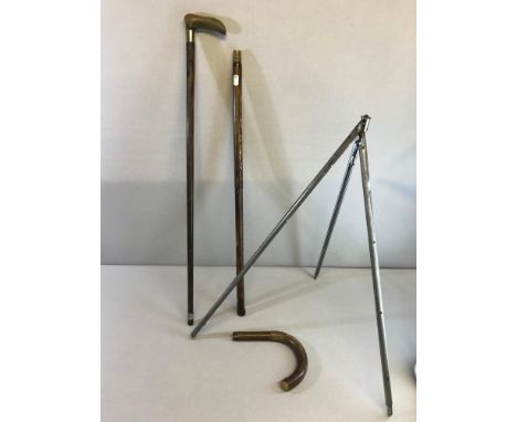 2 Walking sticks, One which is a Jaki 1900's pull out tripod stand probably for the use of a camera 