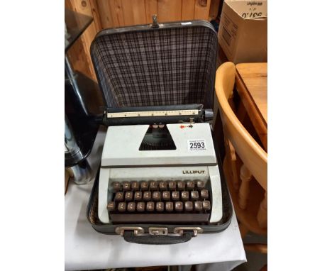 A vintage Lilliput typewriter in carry case COLLECT ONLY