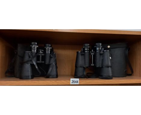 A pair of super zenith 20x50 Binoculars and a pair of Regent 10x50 binoculars. Collect Only 