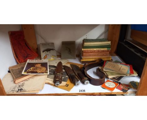 A quantity of vintage scouting books, Girl guide items, badges, belt and knives