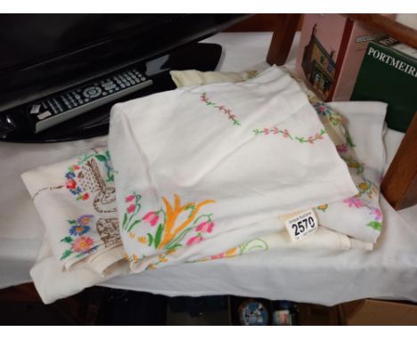 A quantity of vintage embroidered tablecloths