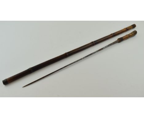 Early 20th century bamboo cased swordstick, with indistinct marks to two sides of blade, 82cm long, blade 46cm long.  