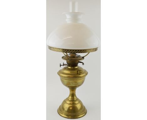 Early 20th century oil lamp. Brass base with opaline glass shade. Height 56cm.  