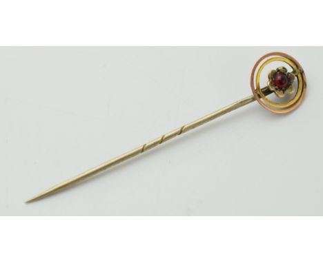 9ct gold headed stick pin with central red stone, floral design, metal pin, 5.5cm long.  