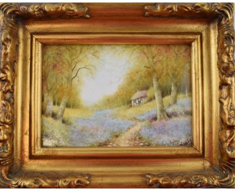 Christopher Hughes (former Royal Worcester artist) hand painted rectangular plaque of 'Bluebell Cottage', in gilt frame, 11.5