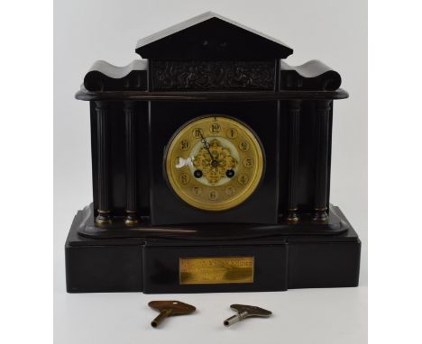 Early 20th century slate mantle clock with columns flanking the central face, with 2 associated keys, 'E Johnson &amp; Son lt