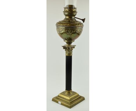 Oil lamp with Corinthian column base in brass by 'Ariel' Lamps. Height with shade 67cm.  