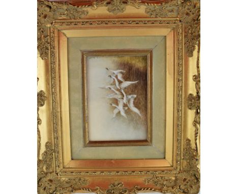 Christopher Hughes (former Royal Worcester artist) hand painted rectangular plaque of Flying Swans , in gilt frame, 16.5cm x 