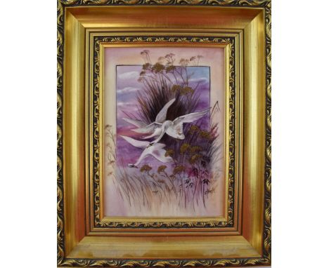 James Skerrett (former Royal Worcester artist) hand painted rectangular plaque of flying swans amongst foliage, in gilt frame