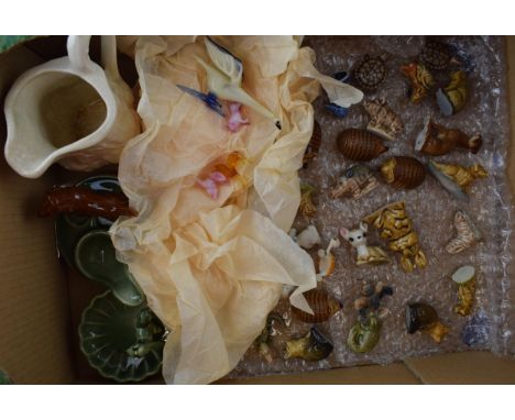 A collection of ceramic items to include Wade Whimseys, miniature glass items, together with other Wade items. (Qty)  