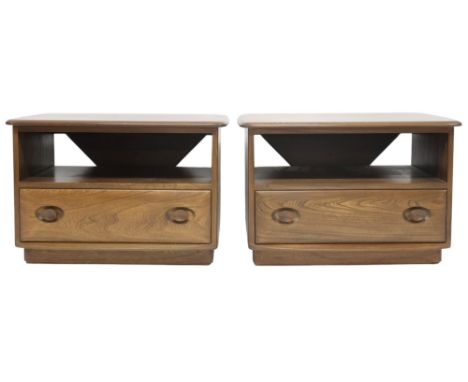 A PAIR 20TH CENTURY ERCOL ELM AND BEECH "WINDSOR" CABINETS&nbsp; shaped tops with rear corner drop flaps over open compartmen