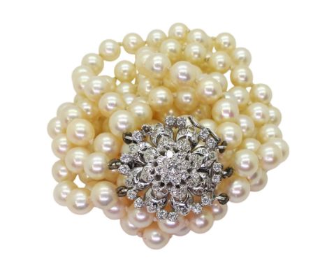 PEARLS WITH DIAMOND CLASP the flower shaped box clasp is set with estimated approx 1.10cts, of brilliant cut diamonds, strung