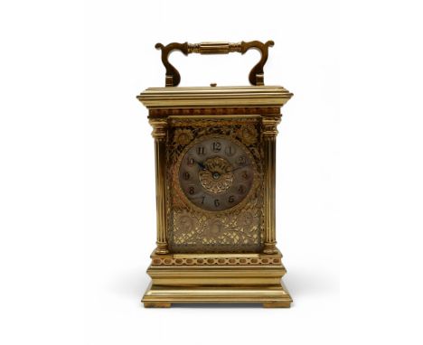 A FRENCH GILT BRASS REPEATING CARRIAGE CLOCK the dial marked for Edward and Sons, with silver chapter ring and Arabic numeral