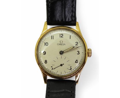A 9CT GOLD OMEGA with a silvered dial, black Arabic numerals, subsidiary seconds dial, with blued and luminous hands. Hallmar