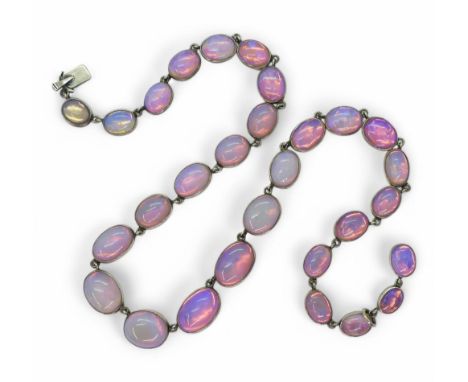 OPAL RIVIERA NECKLACE the semi transparent opals are in closed back white metal settings with a pink foil behind, that gives 