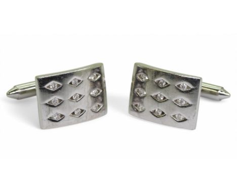 A PAIR OF DIAMOND CUFFLINKS made in 9ct white gold each cufflink is set with nine brilliant cuts in diamond shaped settings. 