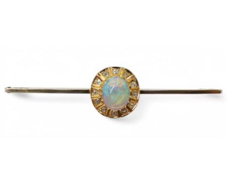 A BLACK OPAL BROOCH set with a 9mm x 7.5mm x 3.9mm cabochon opal, surrounded with old cut diamonds. Length 6.2cm, weight 4.3g