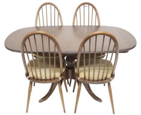 A 20TH CENTURY ERCOL ELM AND BEECH "CHESTER" EXTENDING DINING TABLE AND CHAIRS&nbsp; table with shaped top concealing interna