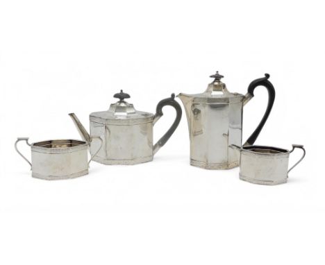 A GEORGE V FOUR PIECE SILVER TEA SERVICE by Roberts &amp; Belk, Sheffield 1921, of faceted form, with diaper banding, with eb