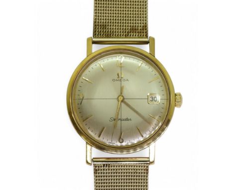 A CROSSHAIRS OMEGA SEAMASTER with silvered dial gold coloured baton and Arabic numerals, with a date apperture. The monocock 