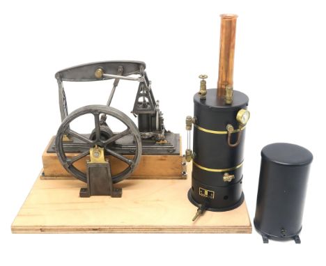 A LIVE STEAM MODEL BEAM ENGINE Of cast iron, steel and brass construction, measuring approx. 26cm in height (exclusive of ply