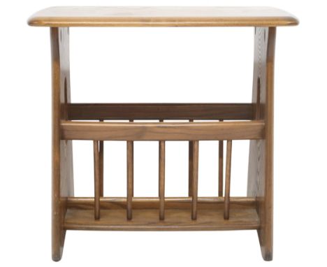 A 20TH CENTURY ERCOL ELM AND BEECH SIDE TABLE/ MAGAZINE RACK&nbsp; shaped top over spindle sided magazine rack with pierced t