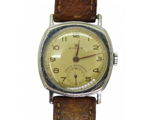 A VINTAGE ROLEX the watch has a yellowed dial with gold coloured Arabic numerals and hands, with a subsidiary seconds dial. w