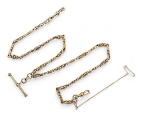 A DECORATIVE FOB CHAIN hand made in bright yellow metal, with twisted baton links and knot links. Length 43cm, weight 23.3gms