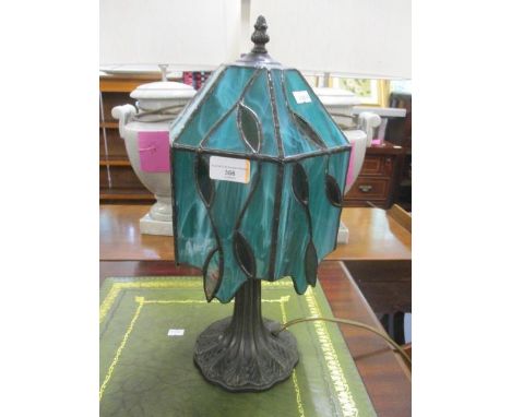 A contemporary Tiffany style pewter table lamp with a green glass shade, 16"h 