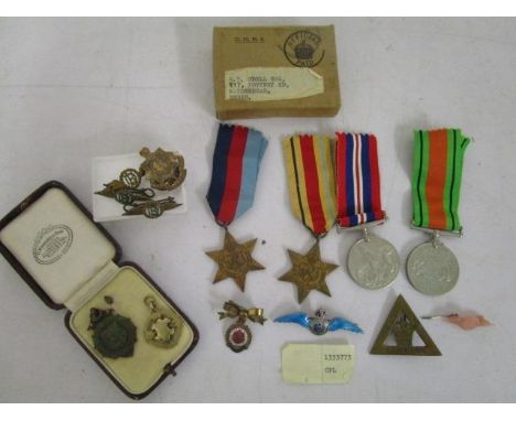 A WWII four medal campaign group comprising 1939-45 Star, Africa Star, British War medal and Defence medal in original card b