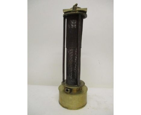 A Davy type brass and gauze minors safety lamp with a hinged top, 10 1/4" h 
