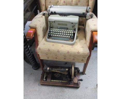 An Imperial 66 typewriter and a Singer sewing machine 
