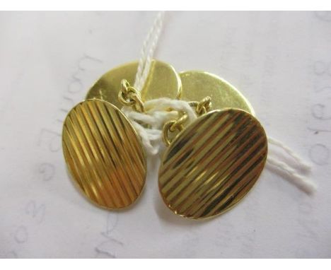 A pair of 18ct gold cufflinks with engine turned decoration 