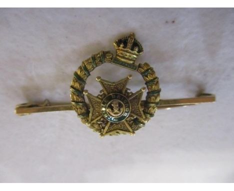 A 9ct gold Rifle Brigade stick pin badge with enamel decoration 
