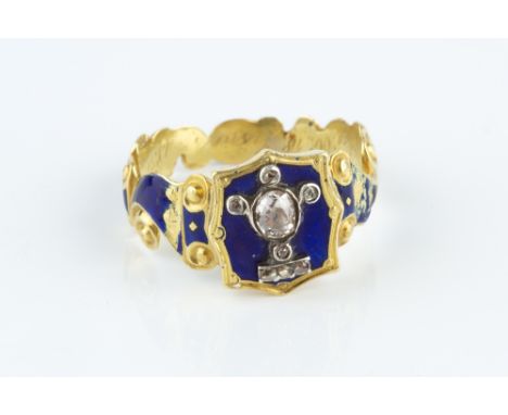 A WILLIAM IV DIAMOND AND ENAMEL MEMORIAL RING, the tapered blue enamel scrolled hoop enclosing a shaped blue enamel panel, ce