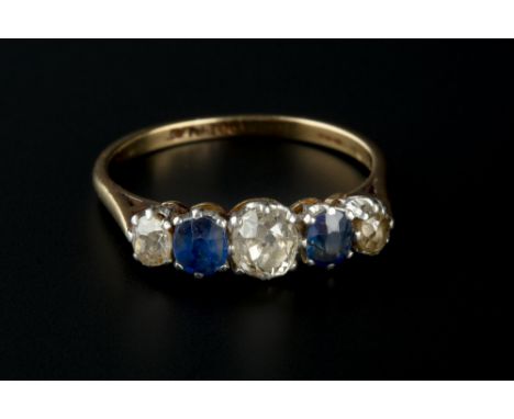 A SAPPHIRE AND DIAMOND FIVE STONE RING, alternately set with graduated cushion-shaped old-cut diamonds and cushion-shaped mix