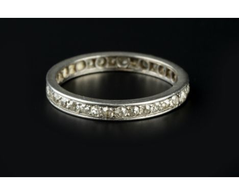 A DIAMOND FULL HOOP ETERNITY RING, set throughout with single and lasque-cut diamonds, white precious metal mounted, (extende