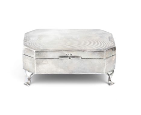 A SILVER RECTANGULAR JEWELLERY CASKET, with canted angles, engine turned decoration and lined interior, on shaped feet, Birmi